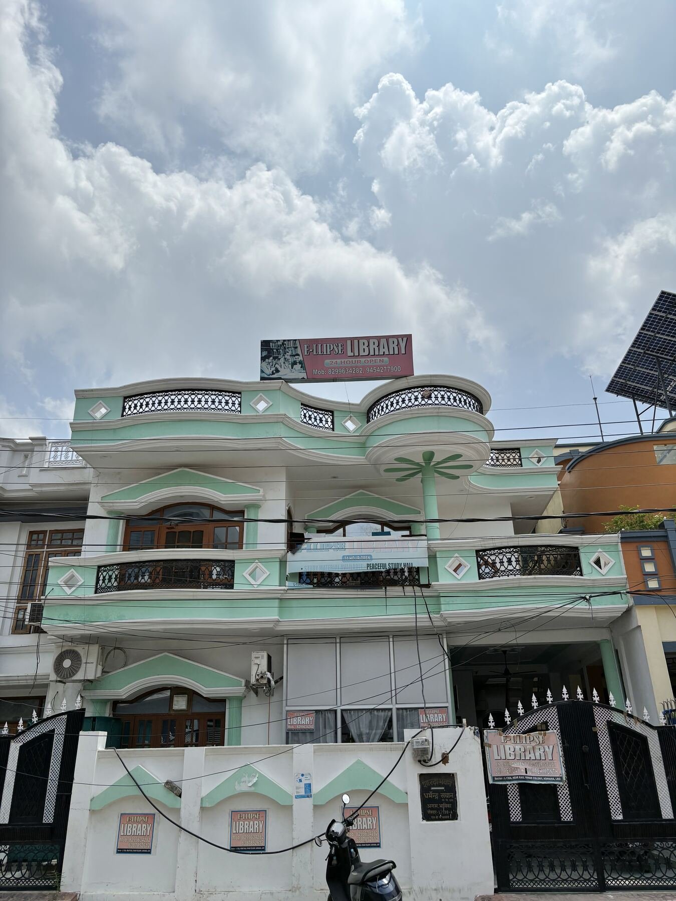 Ellipse Library building in Sector L, Ashiana, Lucknow, with rooftop signage